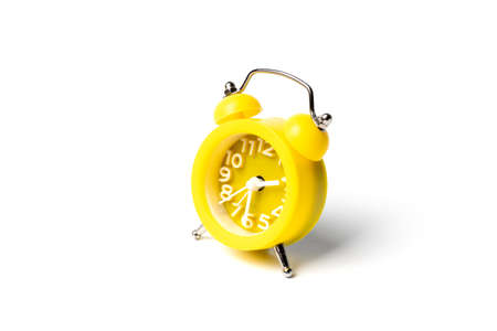 Yellow alarm clock isolated on a white background. The image is ready for processing and insertion.