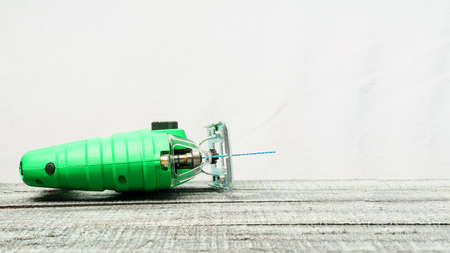 Electric jigsaw on wooden background with copy space