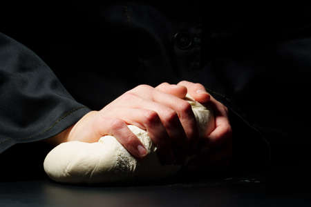 Dough preparation on a dark background. Food concept. Cooking process