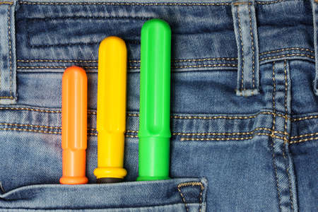 Screwdriver in jeans pocket, employee concept. close-up