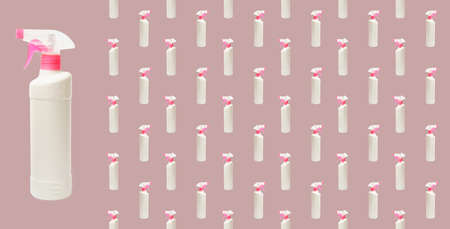 White plastic bottle with a spray bottle on a beige background. Creative packaging design. View from above. Flat lay. Spray bottle patternの写真素材