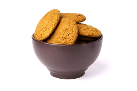 oatmeal cookies in brown plate isolated on white background. close-up