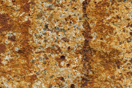 rusty wall background. the gray concrete wall is stained with rust. close-up
