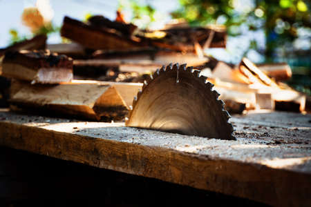 circular power saw for cutting wood. circular saw blade on a wooden machine.の写真素材
