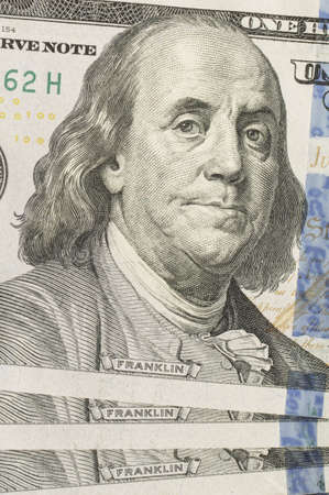 One hundred dollars. Close-up portrait of Benjamin Franklin. USD, US currency.の写真素材