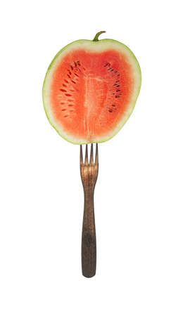 slice of watermelon on a fork isolated on white background.の写真素材