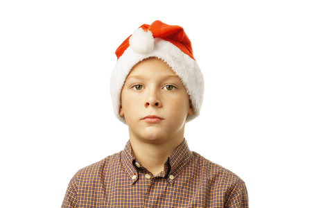 handsome boy in Santa Claus hat isolated on white background.の写真素材