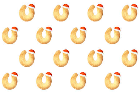 horseshoe bun in santa claus hat isolated on white background. christmas pattern for bakingの写真素材