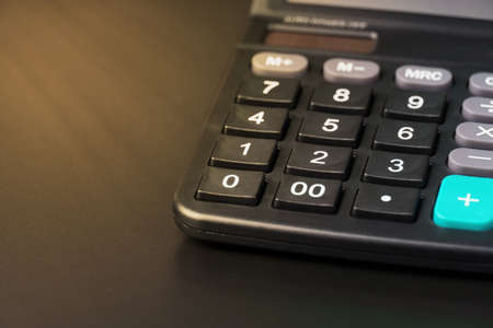 close-up of a calculator on a black background