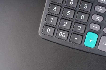 Calculator on a black background. top view with copy spaceの写真素材