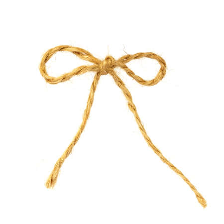 string or twine tied into a bow on white backgroundの写真素材