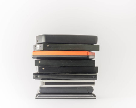 Bunch of external hard drives. Isolated on white. Close up.