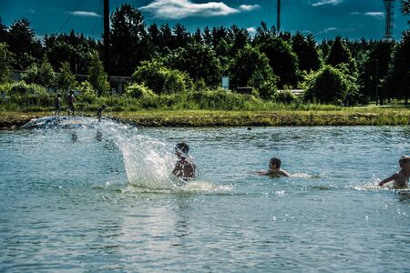 Kids playing in water, jumping, swiming. Summer. Fun.のeditorial素材