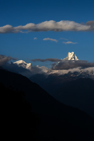 Mount Fishtail (Machapuchare) peak glowing in the morning light. Clear blue sky makes the view more beautiful.の写真素材