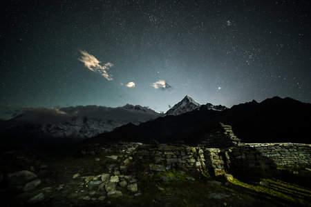 Annapurna South peak visible under a clear starry night from Khopra danda, Nepalの写真素材