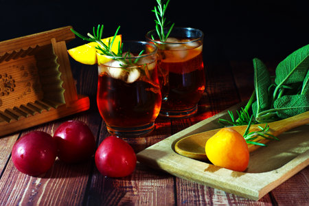 red cocktail with peach rosemary and sage Art Designの写真素材