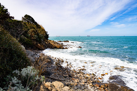 Rocky coast of the Mediterranean Sea on a background of blue skyの写真素材