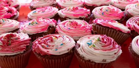 cupcake with strawberry icing on topの写真素材