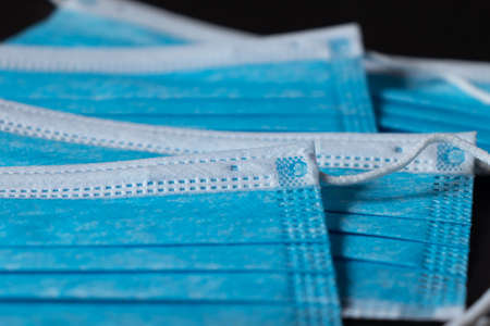 Surgical masks close up dark backgroundの写真素材