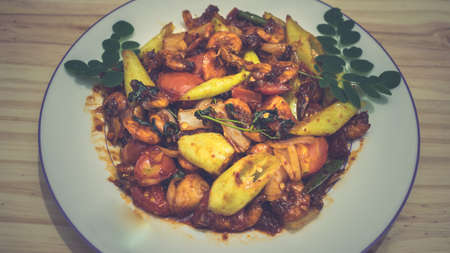 Plate of deviled prawns on a dinner tableの写真素材