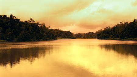 Golden sunset colors in Hiyare reservoir landscape photograph.の写真素材