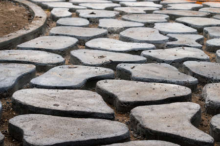 Homemade Concrete interlock blocks pathway pattern, DIY project photo close up, random designs on the pathway.の写真素材