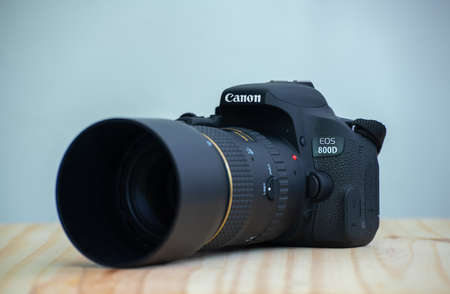Galle, Sri Lanka - 02 18 2021: Canon EOS Rebel t7i DSLR camera and a prime lens with the lens hood...