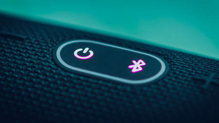 On-off and Bluetooth buttons on the portable and waterproof charge 4 boom box close up. excellent...