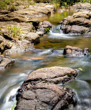 Water stream and rocks in Bambarawana, midday long exposure water flowing photograph, small cascade...