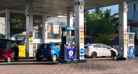 Colombo, Sri Lanka - 03 30 2021: Cars refueling manually in the fuel station in Colombo.のeditorial素材