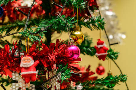 Decorated Christmas tree close up. New year and Christmas season cozy home interior concept.の写真素材