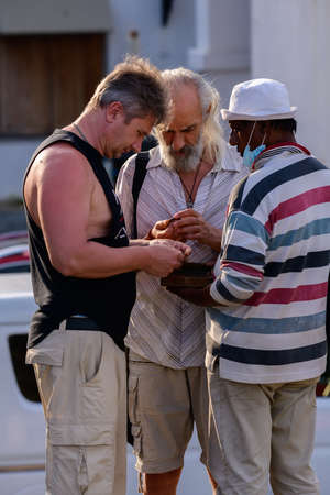 Galle, Sri Lanka - 02 03 2022: Antique dealers and foreign buyers meet up. Senior tourists...