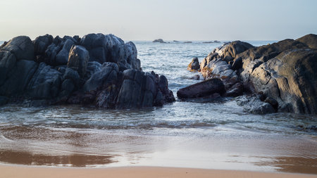 Rock formation on the tropical beach shore in Galle.の写真素材