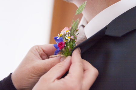 The flower is attached to the bridegroom