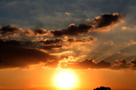 a bright and cloudy sunset or sunrise