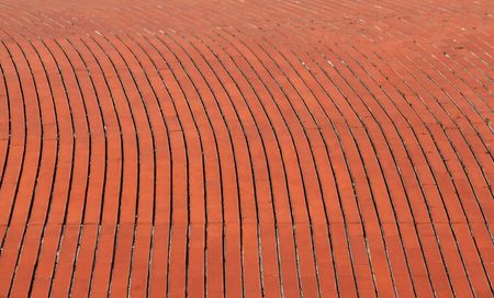 background of a curve red orange brick wallの写真素材
