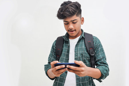 Young Indian college boy Showing Direction With Handの写真素材