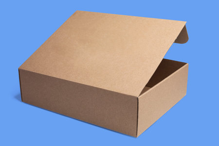 Half open cardboard box on blue background, mockupの写真素材