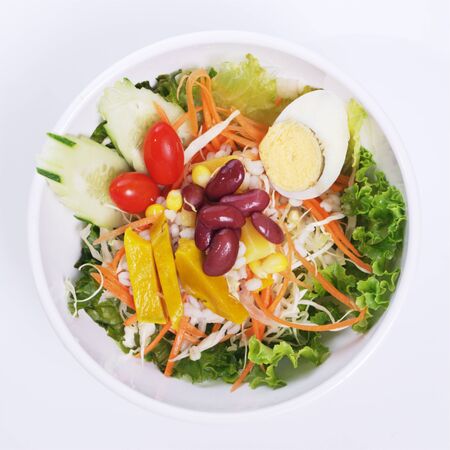 Salads, vegetables and fruit in a bowl. Ready to serve for everyone.の写真素材