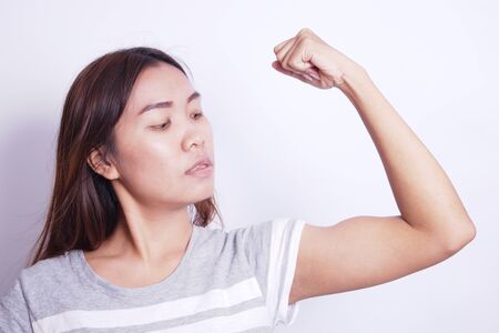 Women shows off her muscular arms, exercise.