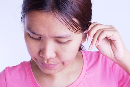 Women are cleaning the inside their ears.の写真素材