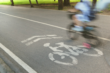 Bicycle sign or icon and movement of cyclist in the parkの写真素材