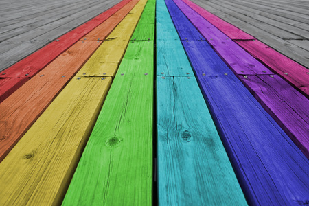 Photos of the rainbow colored wooden backgrounds.の写真素材