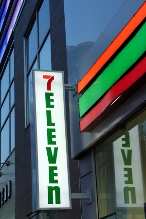 TORONTO, CANADA - MAY 25: 7-Eleven convenience store sign on May 25, 2013 in downtown Toronto, Ontario, Canada. 7-Eleven is the world's largest operator, franchisor and licensor of convenience stores.のeditorial素材