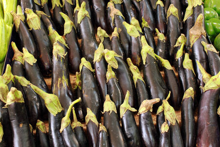 Organic eggplants in  a marketの写真素材