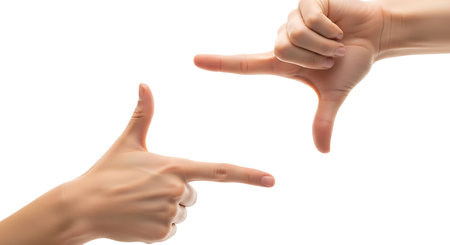 Two hands form a rectangular frame, suggesting composition, focus, and creative vision against a clean white backdrop.の素材