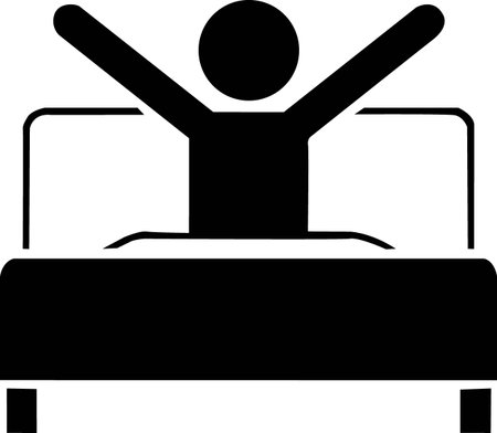 A simple black silhouette of a person stretching their arms up joyfully while sitting in bed.のイラスト素材