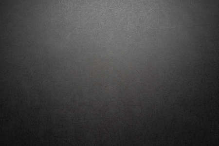 black stone scratched background texture with radial gradient lightの写真素材