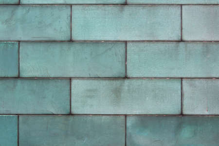 green tarnished copper background metal texture with copy spaceの写真素材