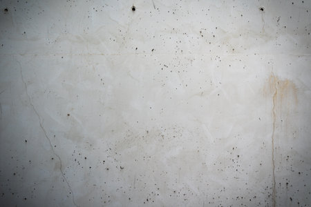 smooth cracked concrete background texture with scratches, stains and copy spaceの写真素材